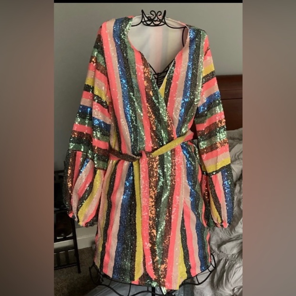 Sequin wrap dress . Get the party started .